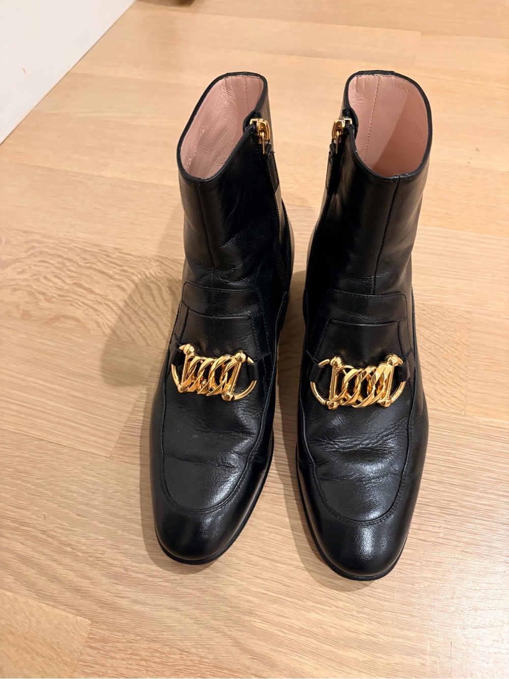 Gucci Black Leather Ankle Boots with Gold Chain Accent